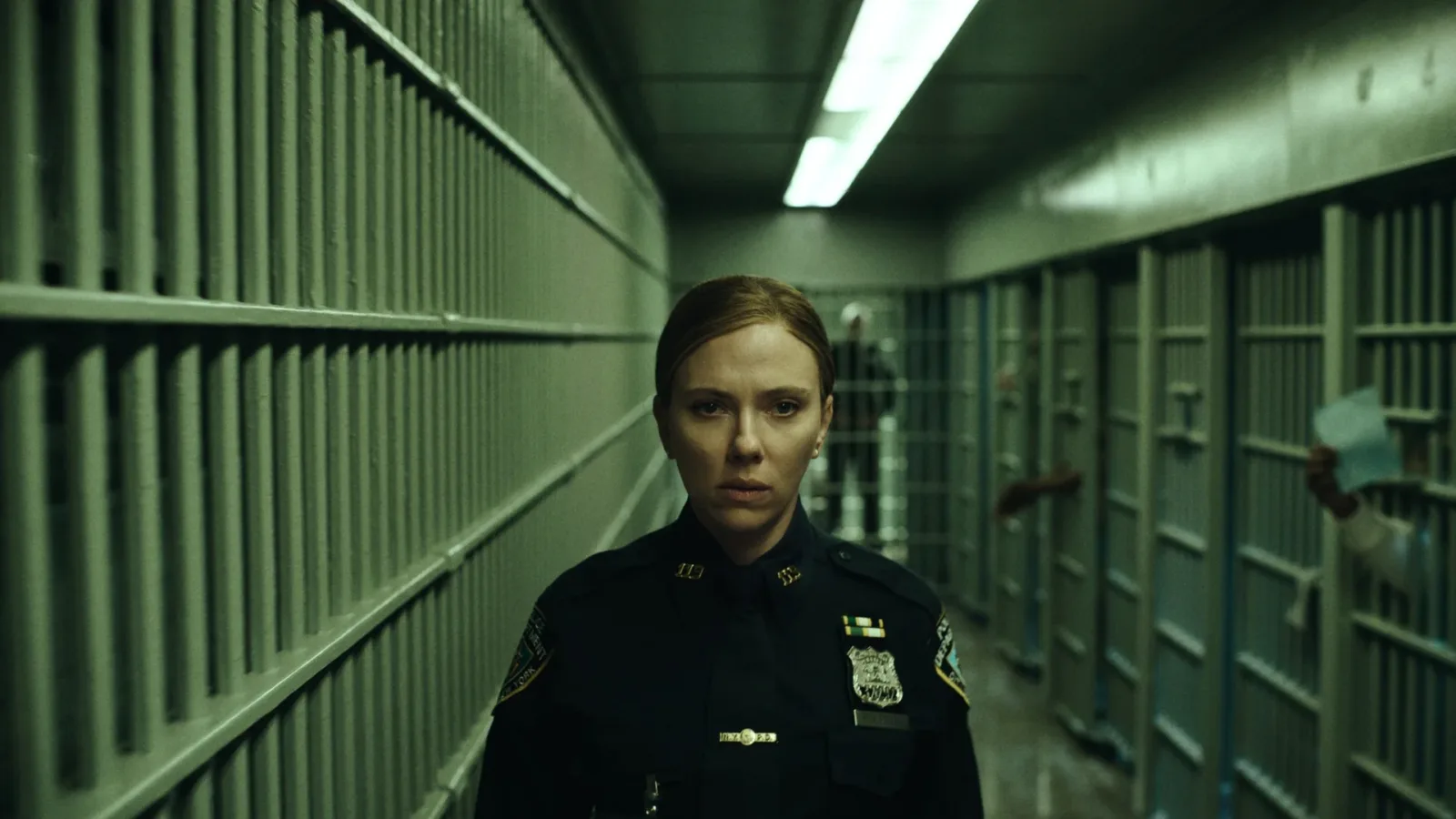 Scarlett Johansson as Detective Julie Miller in a prison cell block in The Exorcist: Martyrs