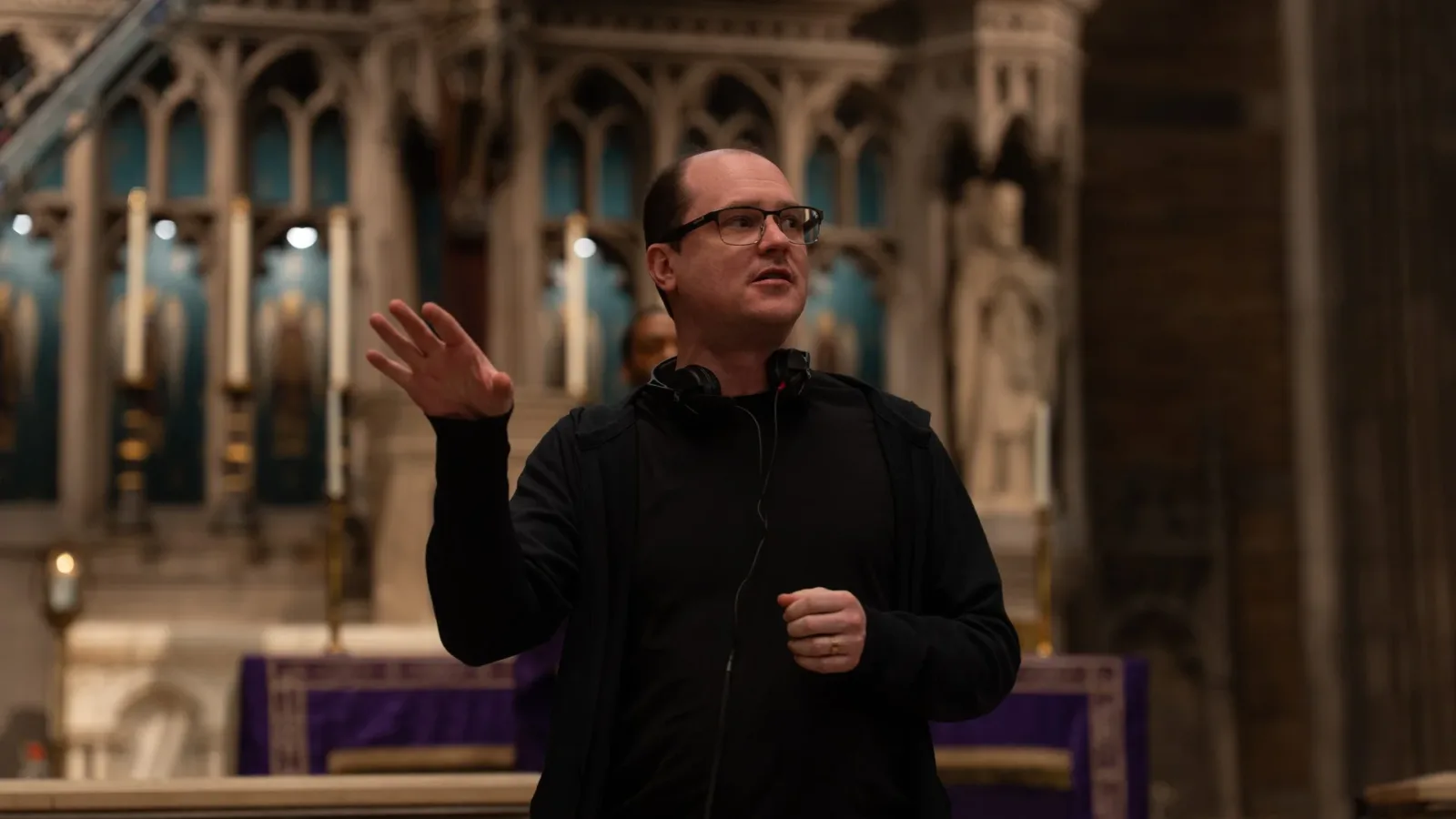 Director Mike Flanagan on set in a church for The Exorcist: Martyrs